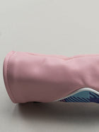 Pink golf club head cover with a pink yellow and blue plaid window
