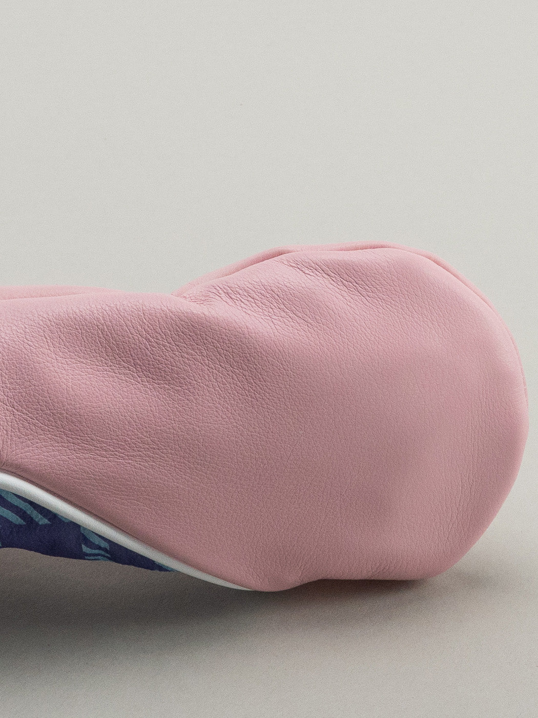 Pink golf club head cover with a pink yellow and blue plaid window