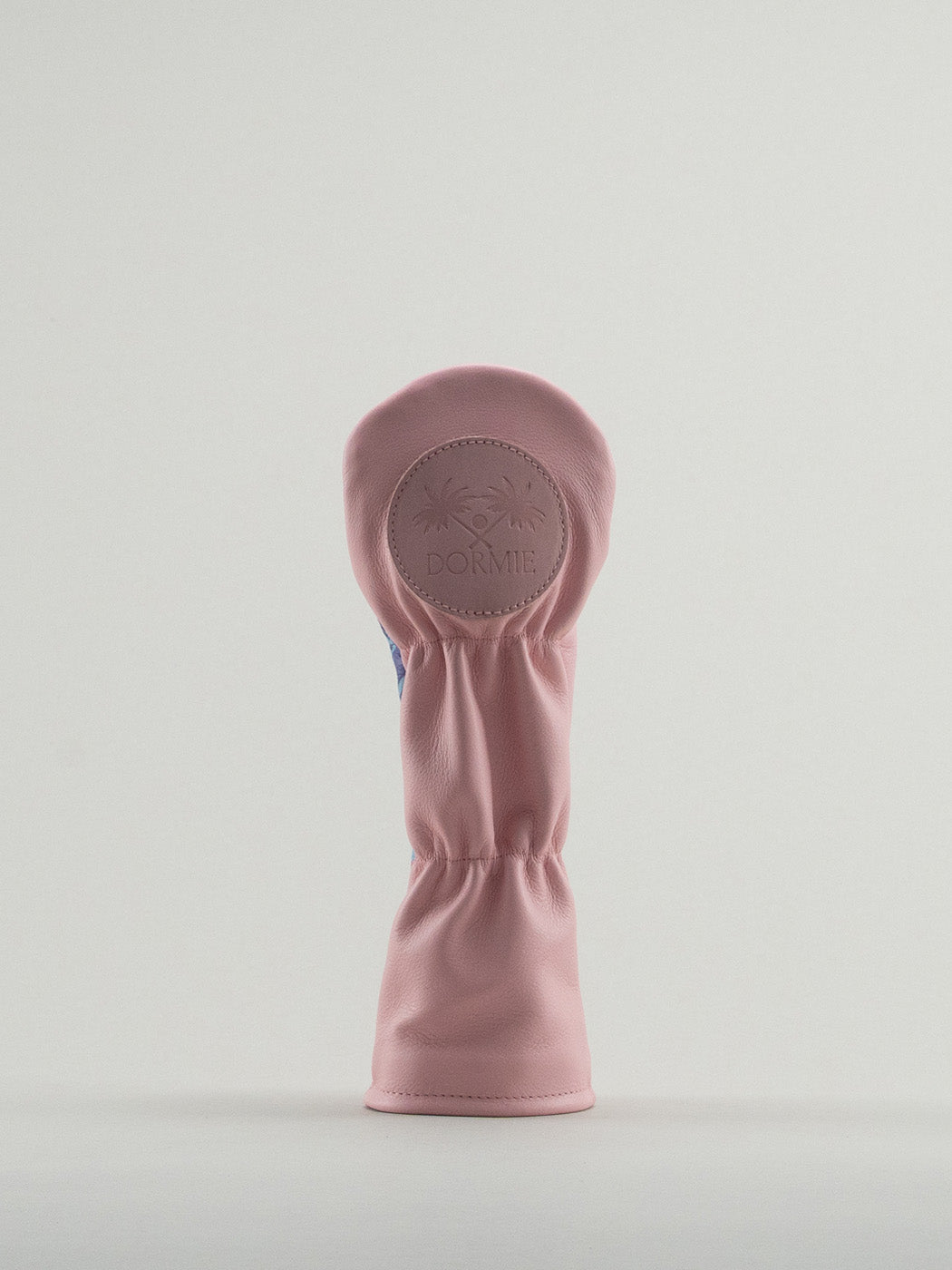 Reverse of pink golf club headcover with pink dormie badge