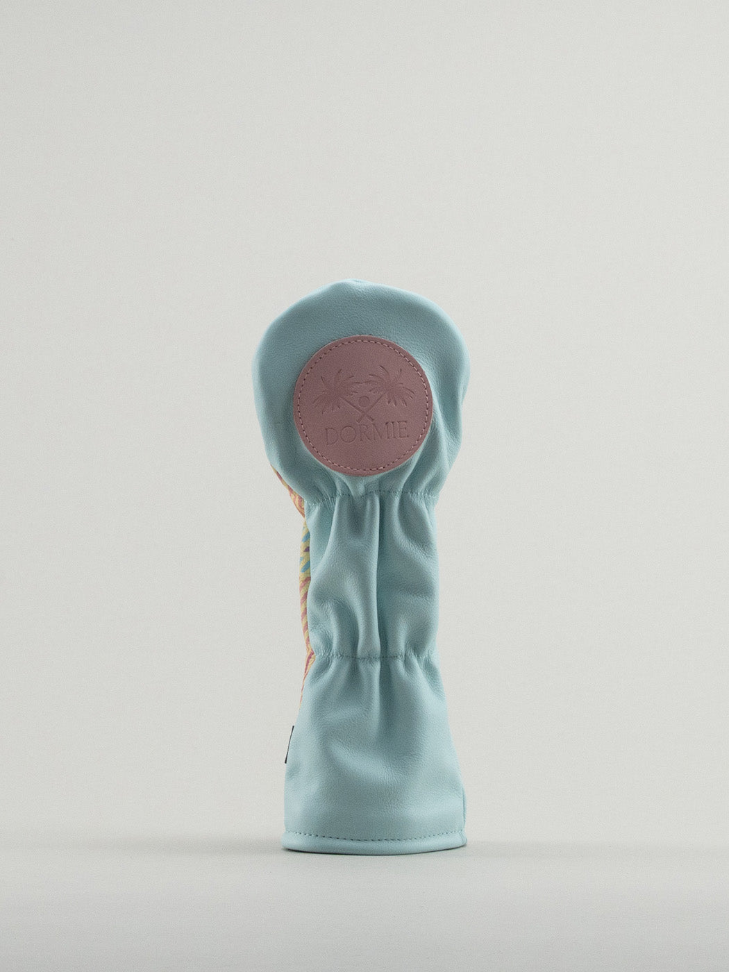 Reverse of blue leather headcover with pink Dormie badge