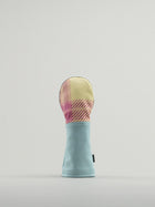 Golf club headcover made of pink and yellow plaid with a blue leather base.
