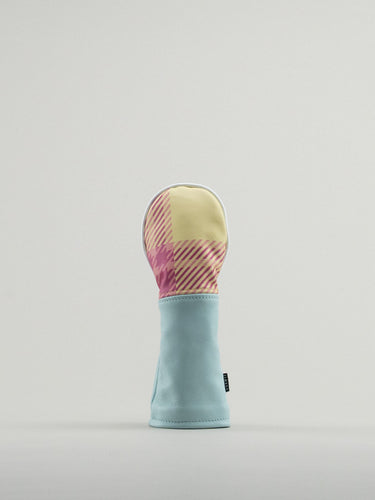Golf club headcover made of pink and yellow plaid with a blue leather base.