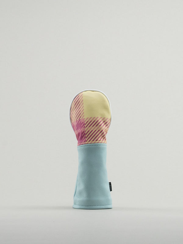 Golf club headcover made of pink and yellow plaid with a blue leather base.