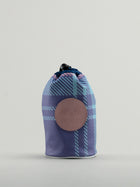 Blue and pink tartan bag showing leather badge with dormie embossed on it.