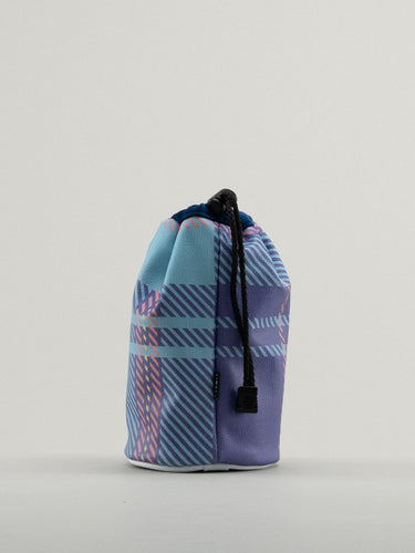 Blue and pink tartan bag showing leather badge with dormie embossed on it.