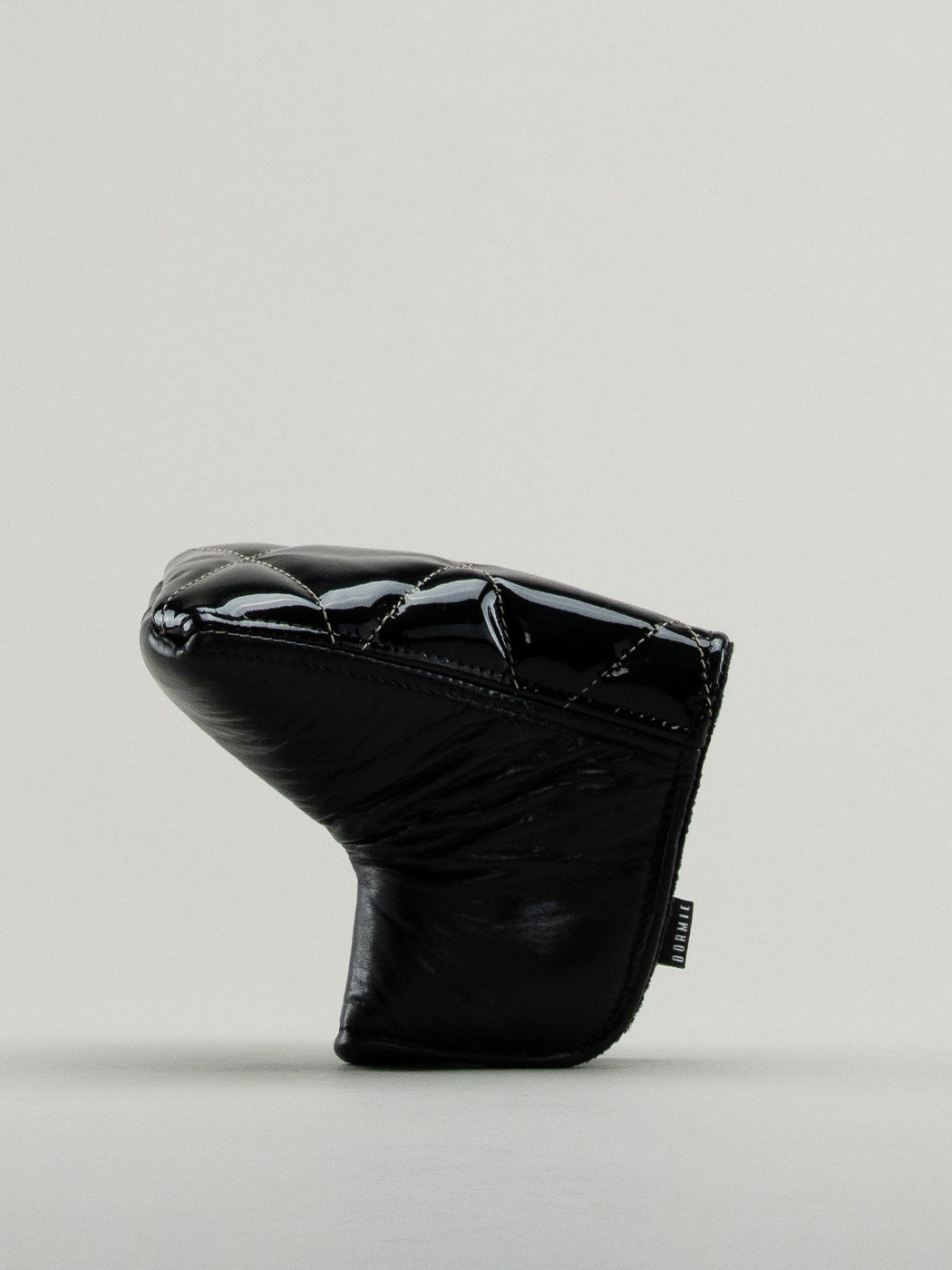 Black quilted leather golf headcover.