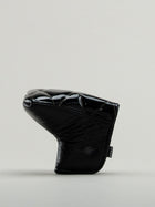 Black quilted leather golf headcover.