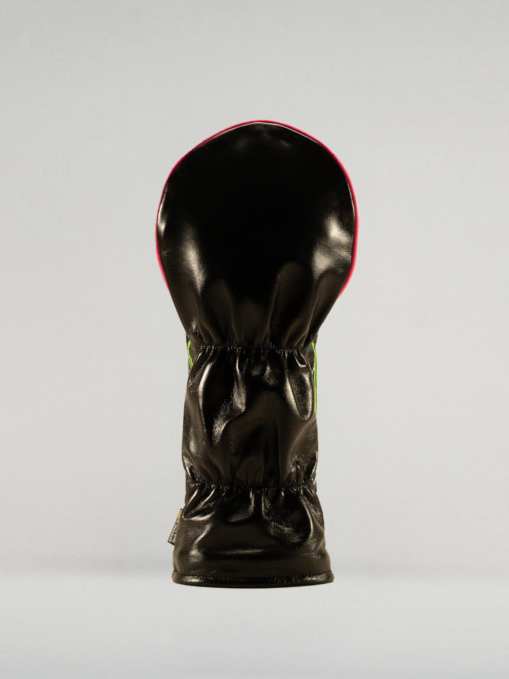 Reverse side of the neon nights headcover showing black leather backing.